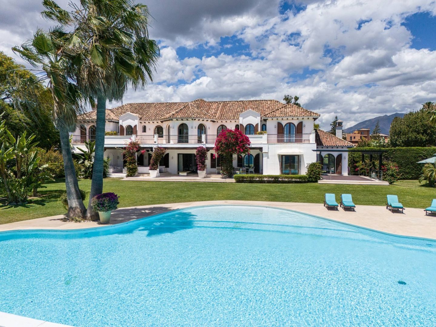Pool and villa as they appear in the listing photo